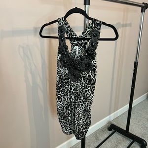 From the office, to happy hour! Pair with a chic blazer or dark denim & heels!